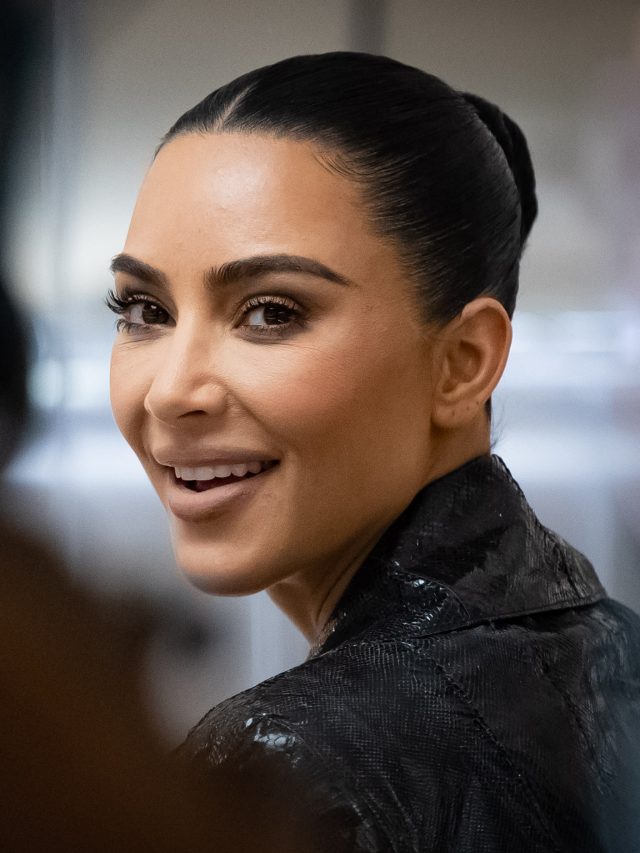 Kim kardashian poses in bikini and thigh-high boots in health club